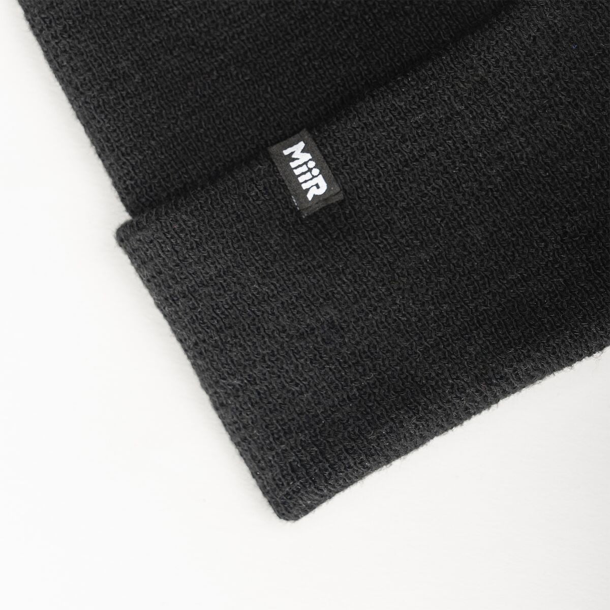 recycled-poly-fine-knit-beanie-w1 WebPDP-RecycledPolyFineKnitBeanie_Studio_TagDetail_Black__BNE005002OS.jpg